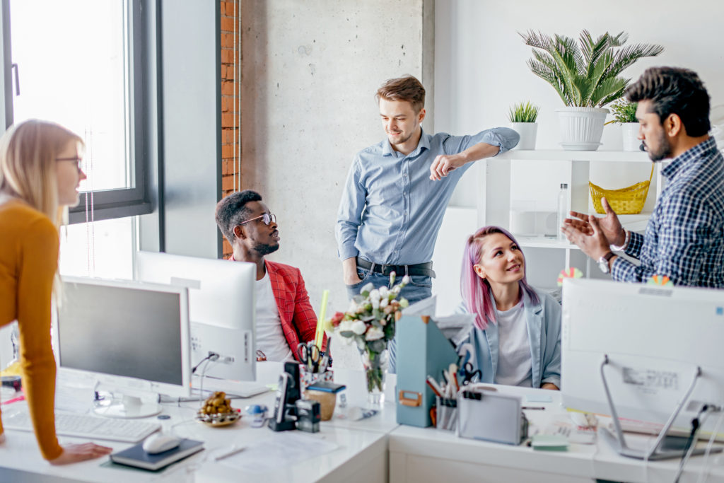 Business people at work in a busy luxury office space